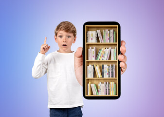 School boy finger pointing up, smartphone with books on gradient