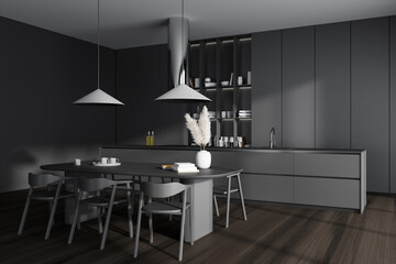 Grey kitchen interior with bar countertop, dining table and decoration