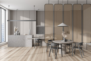 Cozy kitchen interior with eating and cooking zone, panoramic window