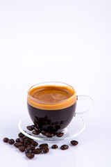 Coffee cup and coffee beans on the white background.
