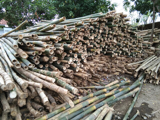 pile of bamboo sticks at a bamboo seller, very useful for various things
