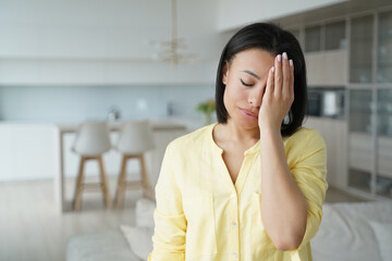 Facepalm, oh no. Upset female cover face with palm, feel regret blaming herself for failure at home