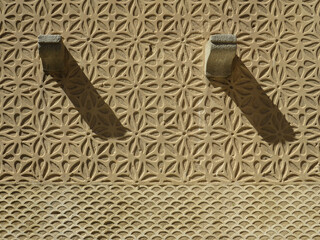 Detail of facade with sgraffito geometric decoration in the historic city center of Segovia. Spain....