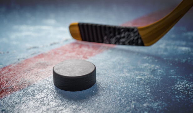 Hockey puck on ice at stadium.