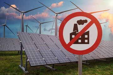Green deal and CO2 carbon dioxide neutrality concept. Fossil power plant banned. Photovoltaic power plant in background. 