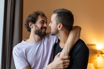 Obraz premium Portrait of Carefree Gay Couple Indoors. Happy gay couple spending time together