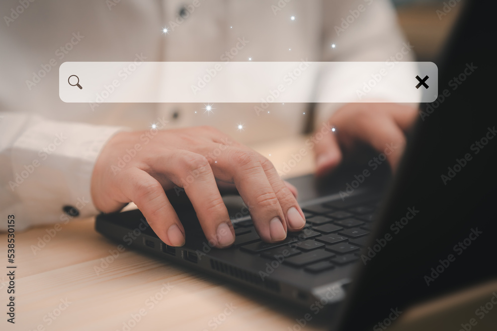 Poster Businessman's hand working with computer laptop on desk in home. Searching Browsing Internet Data Information with blank search bar. Search Engine Optimization SEO Networking Concept.