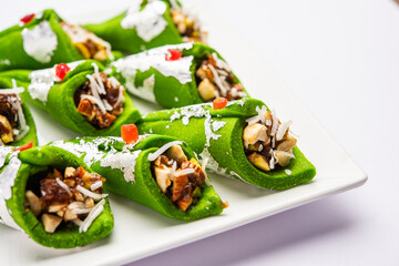 Kaju Gulkand Paan Mithai barfi - Indian sweet or dessert served in a plate