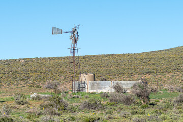 Broken windmill, dam and tank above Ouberg Pass near Sutherland