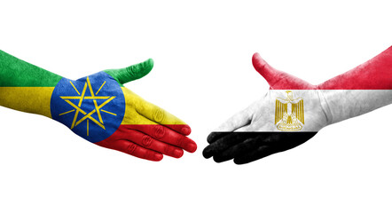 Handshake between Egypt and Ethiopia flags painted on hands, isolated transparent image.