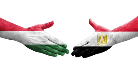Handshake between Egypt and Hungary flags painted on hands, isolated transparent image.