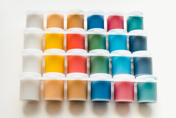 Jars with gouache on a white background. Colored gouache.