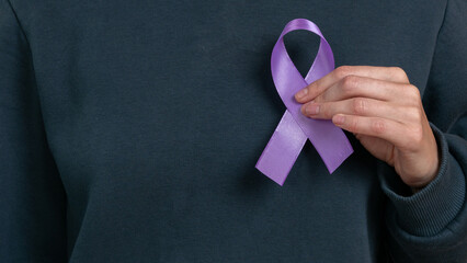 Woman holding a purple ribbon in her hands ADD,ADHD,Alzheimer Disease ,Arnold Chiari Malformation,Childhood Hemiplegia stroke, Epilepsy, Chronic Acute Pain,Crohns - obrazy, fototapety, plakaty