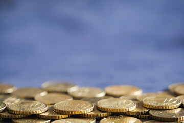 Heap of euro cents coins on metal surface. Money saving concept