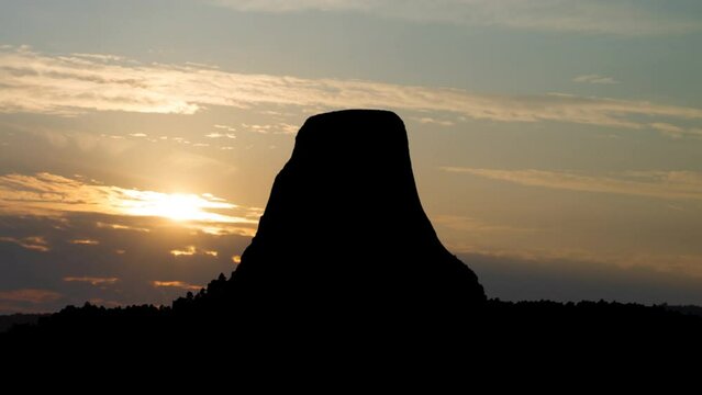 Devils Tower National Monumen, Time Lapse at Sunrise with Colorful Clouds, Wyoming, USA