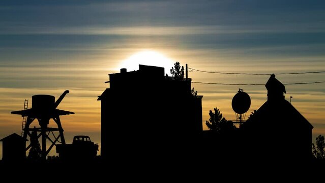 Vintage buildings and old cars abandoned in the old mining town of El Dorado, Time Lapse at Sunset, Nelson Cutoff Rd, Nevada, USA