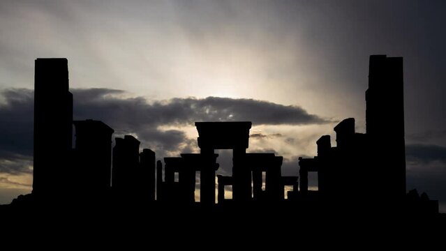 Ruins of Persepolis at Sunrise, Time Lapse with Fast Clouds and Dark Silhouette of the Tachara