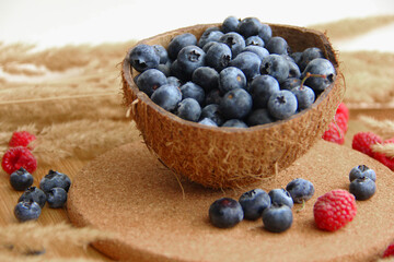 blueberry. blueberries in coconut peel on a wooden table
