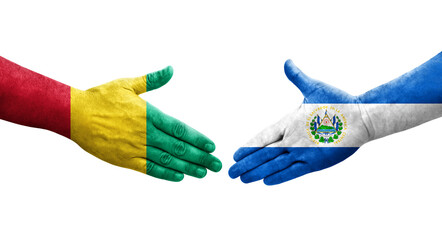 Handshake between El Salvador and Guinea flags painted on hands, isolated transparent image.