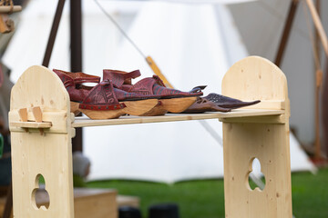 Jester shoes on a medieval market bench