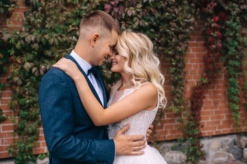 Sensual wedding couple embracing. Romantic moments of newlyweds.