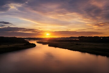 Obraz premium A beautiful and tranquil sunset over a river. 
