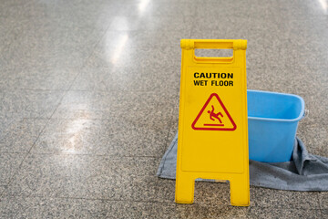 Warning sign caution wet floor indoor, close up