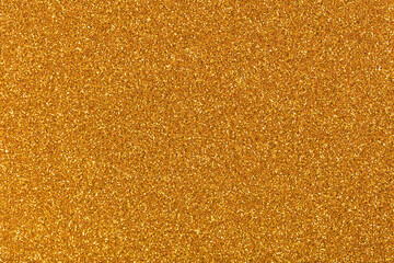 Shiny gold glitter background, new texture for elegant style. Sparkling lights festive background with texture. Abstract Christmas twinkled bright bokeh defocused and Falling stars.