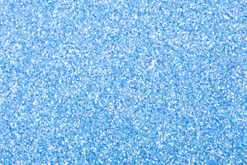 Light blue holographic glitter texture. Blue sparkling lights festive background with texture....