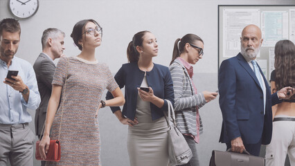 Diverse people waiting in a corporate building