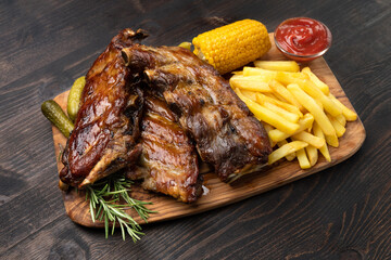 Spare ribs Grilled pork ribs with barbecue sauce and ketchup and grilled vegetables