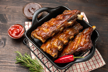 Spare ribs Grilled pork ribs with barbecue sauce and ketchup and grilled vegetables