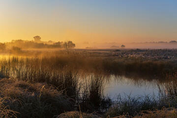 october sunrise over the lake