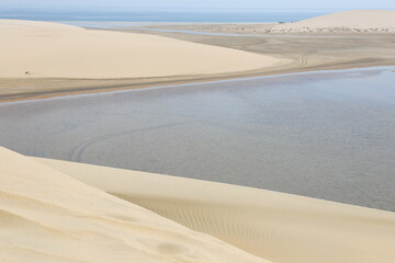 white dunes next to the inland sea in the desert of Qatar