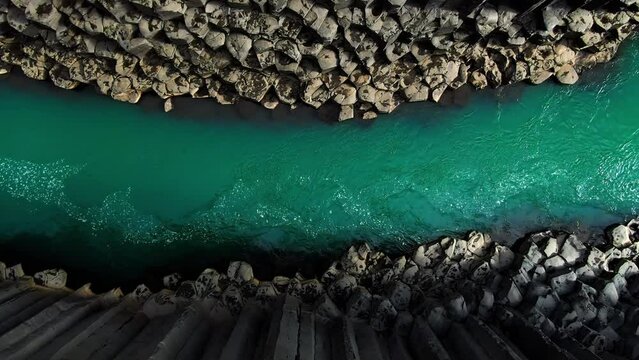 top down view aerial shot drone of scenic icelandic canyon studlagil,rising up from the river flows into basaltic rock formation,iceland nature