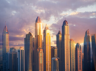 Dubai Marina skyscrapers complex of residential and office buildings at sunset. Dubai, UAE