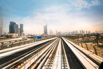 Fototapeta na wymiar Dubai, UAE. Train, tube track with City view at the distance
