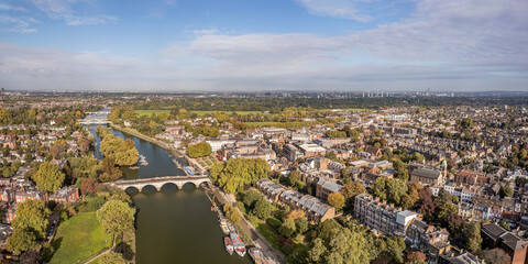 The aerial panoramic view of Thames river runs through Richmond town centre on the east bank with its neighbouring district of East Twickenham to the west, London.