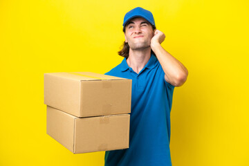 Delivery handsome man isolated on yellow background frustrated and covering ears