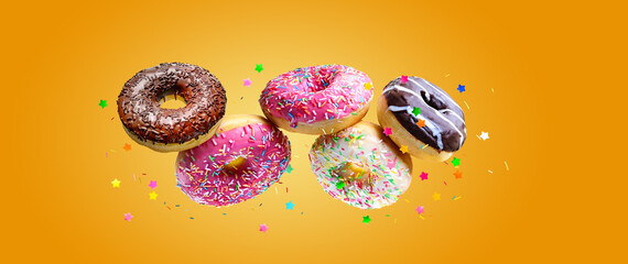 Flying glazed Various donuts over yellow background.