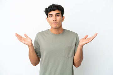 Fototapeta premium Young Argentinian man isolated on white background making doubts gesture