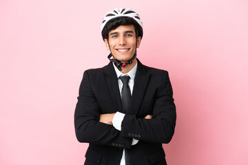 Argentinian businessman with bike helmen isoleted on pink background