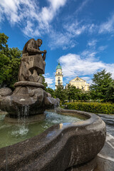 Fototapeta premium Fountain in front of St. Joseph, a Roman Catholic church located in Maxvorstadt, Munich, Germany.