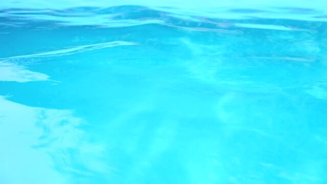 Pool water background. Abstract water background in a swimming pool. Slow motion