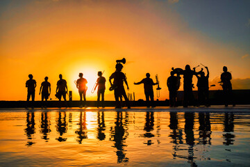 Silhouettes of musicians at sunset