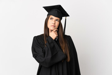 Teenager Brazilian university graduate over isolated white background having doubts