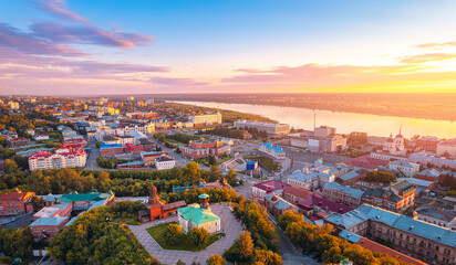 Naklejka premium Panorama city Tomsk and Tom River with sunlight. Aerial top view