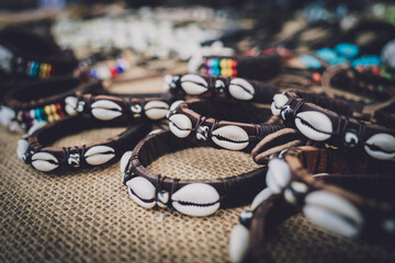 Many colorful bracelets from handcraft souvenirs shop