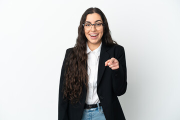 Young business woman isolated on white background surprised and pointing front