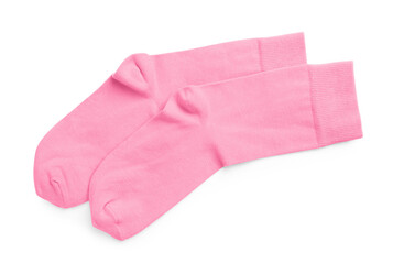 Pair of pink socks on white background, top view